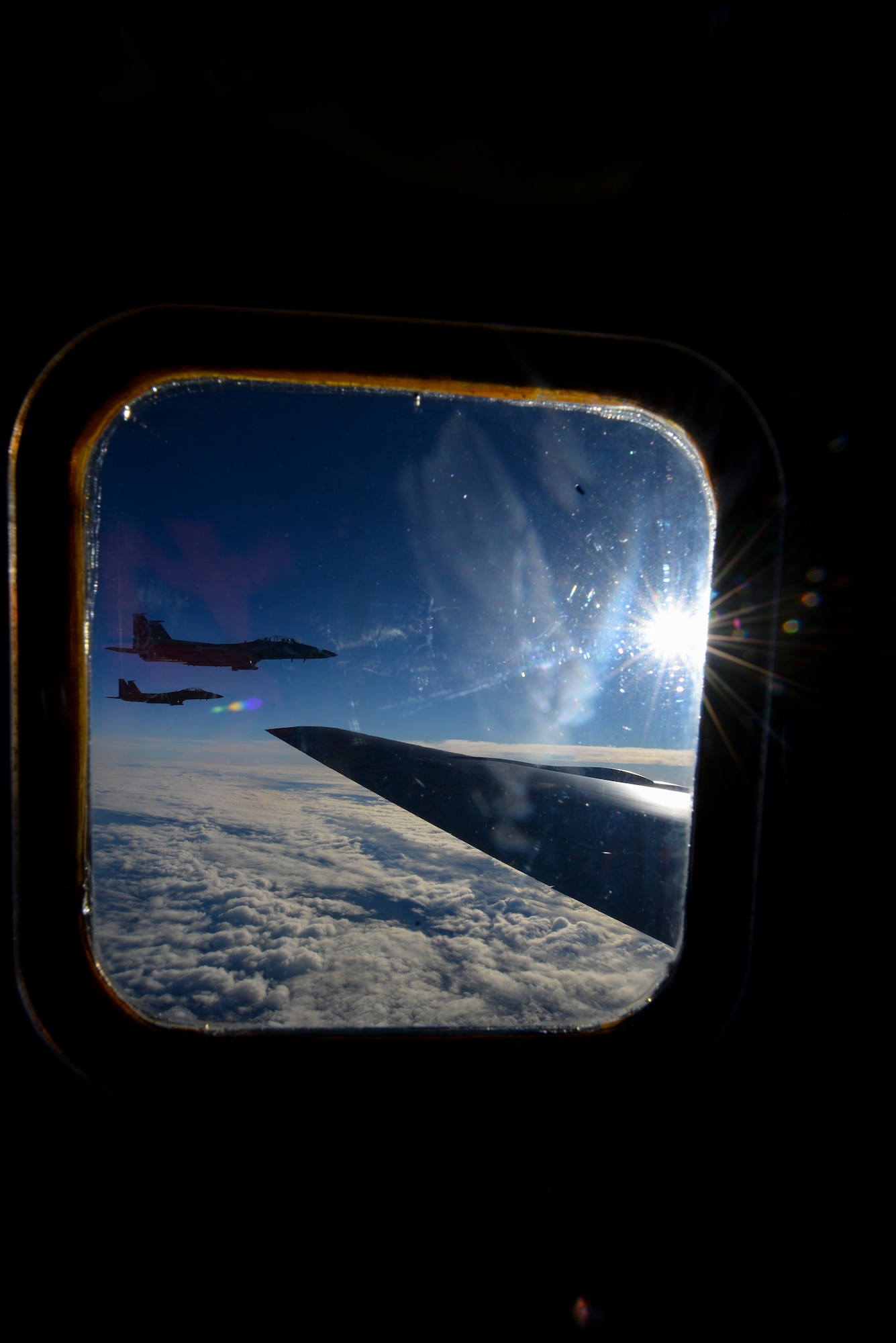 U.S. Air Force F-15D Eagles assigned to the 48th Fighter Wing from RAF Lakenheath, England, fly in formation off of the wing of a KC-135 Stratotanker assigned to the 349th Air Mobility Wing from Beale Air Force Base, Calif., Dec. 2, 2016, over the Atlantic Ocean. The Eagle can be armed with combinations of different air-to-air weapons:  AIM-120 advanced medium range air-to-air missiles on its lower fuselage corners, AIM-9L/M Sidewinder or AIM-120 missiles on two pylons under the wings, and an internal 20mm Gatling gun in the right wing root. (U.S. Air Force photo by Staff Sgt. Micaiah Anthony)