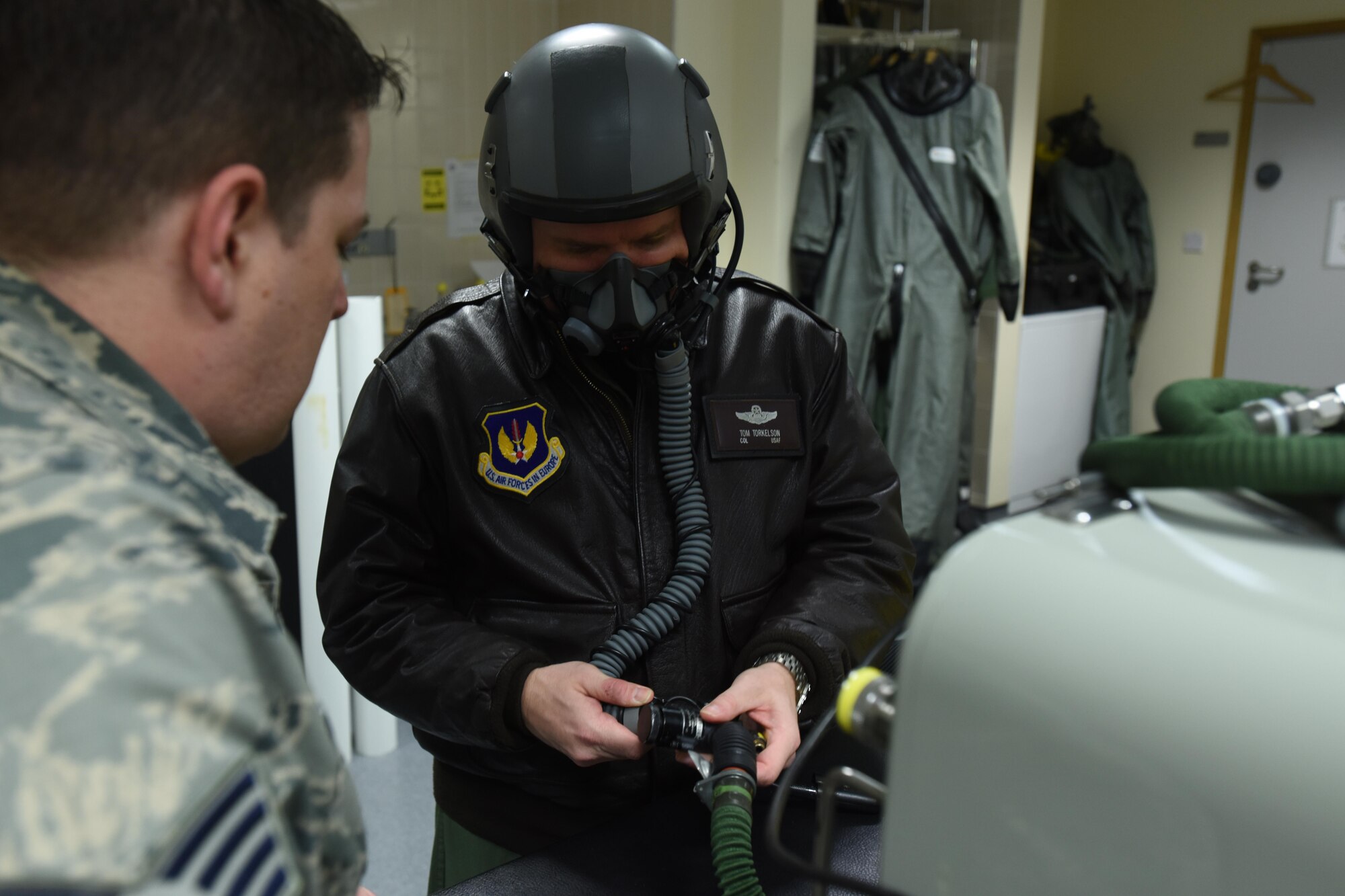U.S. Air Force Col. Thomas Torkelson, 100th Air Refueling Wing commander, tests his helmet before his flight in an F-15D Eagle Dec. 2, 2016, on RAF Lakenheath, England. Torkelson flew in an F-15 to see the air refueling process from the eyes of the fighter pilot (U.S. Air Force photo/Airman 1st Class Eli Chevalier)