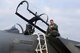 U.S. Air Force Col. Thomas Torkelson, 100th Air Refueling Wing commander, poses for a photo after his flight in an F-15D Eagle Dec. 2, 2016, on RAF Lakenheath, England. Torkelson had the chance to view the air refueling process from the eyes of the fighter pilot. (U.S. Air Force photo/Airman 1st Class Eli Chevalier) 