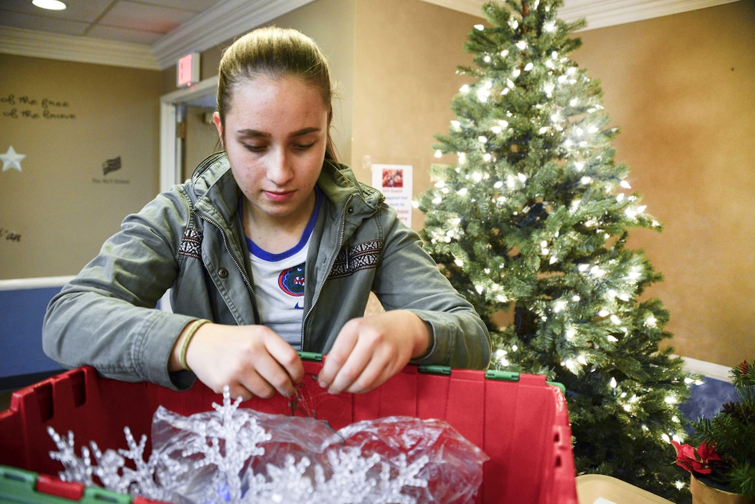 Airman Jaclyn Peterson, 92nd Logistics Readiness Squadron refuel equipment operator, untangles the electric lights during the 92nd Logistics Readiness Squadron annual volunteer event Dec. 2, 2016, at the Spokane Veterans Home in Spokane. Twenty-six Airmen from the 92nd LRS took the time to set the holiday vibe for veterans and spread the holiday cheer by putting up wreaths, Holiday trees and lights all over the facility.
(U.S. Air Force photo/Senior Airman Janelle Patiño)