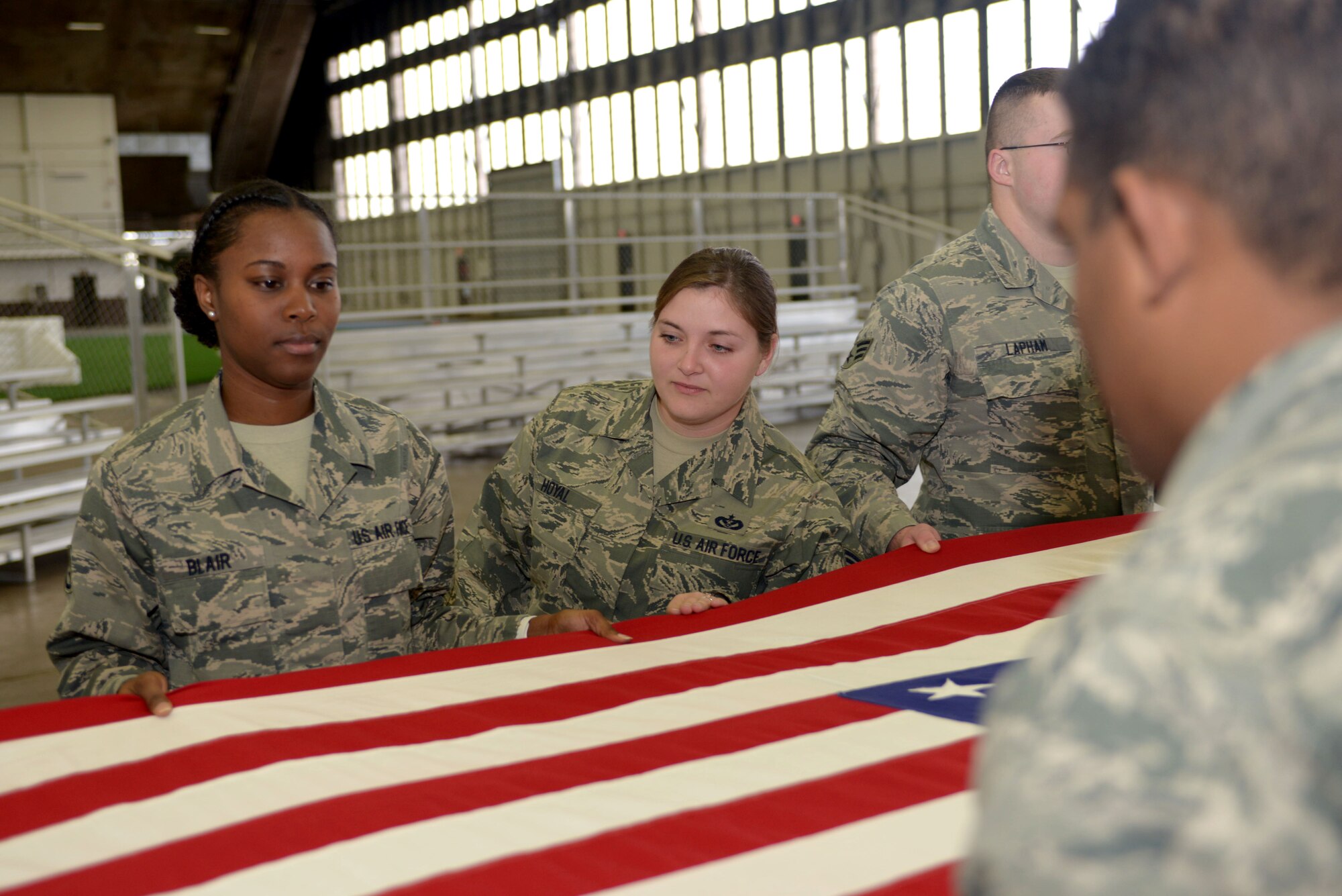 Staff Sgt. Michelle Hoyal, an honor guard flight sergeant assigned to the 28th Force Support Squadron, ensures drills are performed properly at Ellsworth Air Force Base, S.D., Dec. 2, 2016. During funeral ceremonies, members of the Ellsworth Honor Guard fold the U.S. flag in honor of the fallen servicemember and present it to the servicemember’s next of kin. (U.S. Air Force photo by Airman 1st Class Donald C. Knechtel)