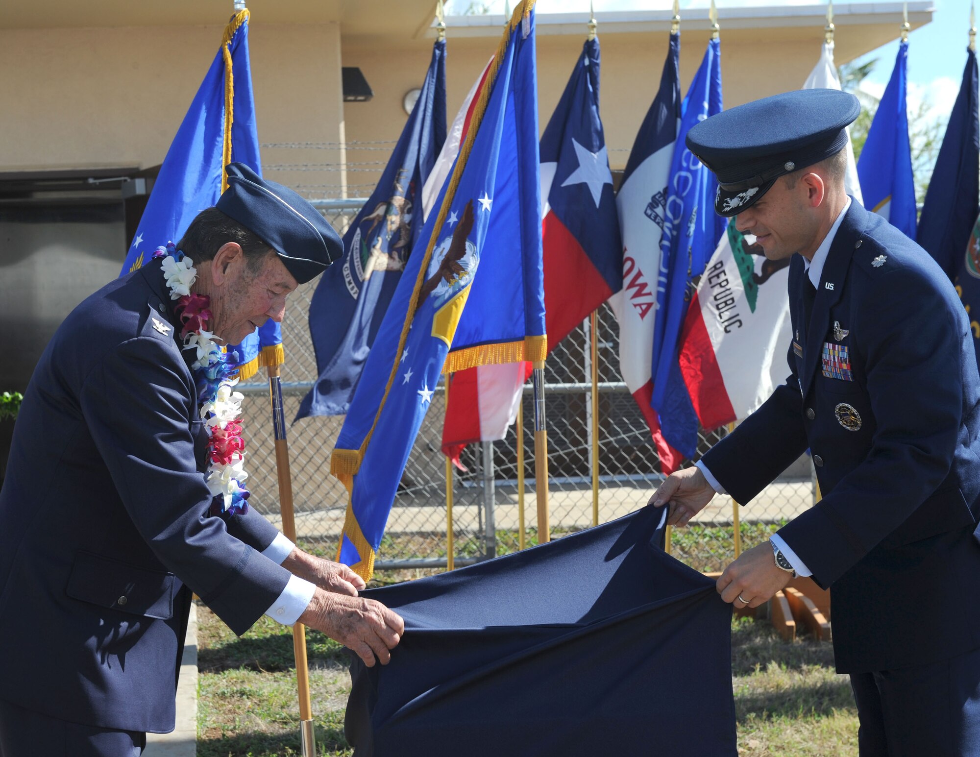 U.S. Air Force retired Colonel Robert Blake, son of Lt. Gen. Gordon A. Blake, and Lt. Col. Marc Greene, 15th Operations Support Squadron commander, unveil a memorial plaque during the tower dedication ceremony in honor of Lt. Gen. Blake, at Joint Base Pearl Harbor-Hickam Dec. 5, 2016. During the attack on Pearl Harbor Dec. 7, 1941, then Major Blake, was the base operations officer at Hickam Field and earned the Silver Star for his actions during the attack. Dec. 7, 2016 marks the 75th anniversary of the attacks and the U.S. military and State of Hawaii are hosting a series of remembrance events to honor the Pacific Theater's veterans. (U.S. Air Force photo by Tech. Sgt. Taylor Worley)