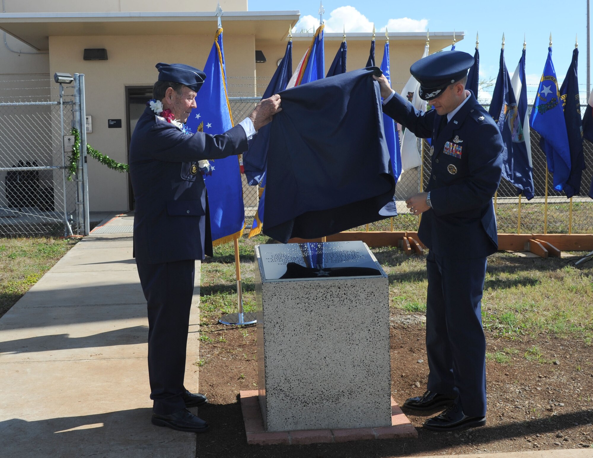 U.S. Air Force retired Colonel Robert Blake, son of Lt. Gen. Gordon A. Blake, and Lt. Col. Marc Greene, 15th Operations Support Squadron commander, unveil a memorial plaque during the tower dedication ceremony in honor of Lt. Gen. Blake, at Joint Base Pearl Harbor-Hickam Dec. 5, 2016. During the attack on Pearl Harbor Dec. 7, 1941, then Major Blake, was the base operations officer at Hickam Field and earned the Silver Star for his actions during the attack. Dec. 7, 2016 marks the 75th anniversary of the attacks and the U.S. military and State of Hawaii are hosting a series of remembrance events to honor the Pacific Theater's veterans. (U.S. Air Force photo by Tech. Sgt. Taylor Worley)