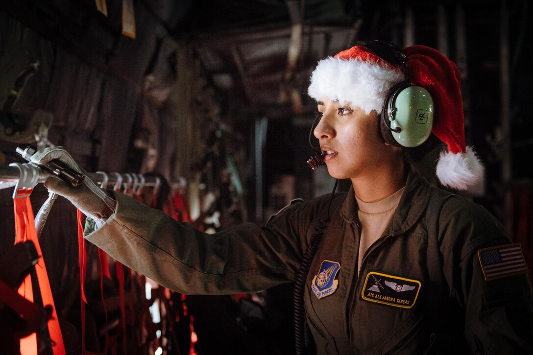 Air Force Airman 1st Class Alejandra Vargas performs preflight inspections during Operation Christmas Drop at Andersen Air Force Base, Guam, Dec. 5, 2016. Vargas is a C-130 Hercules loadmaster assigned to the 36th Airlift Squadron. Air Force photo by Senior Airman Delano Scott