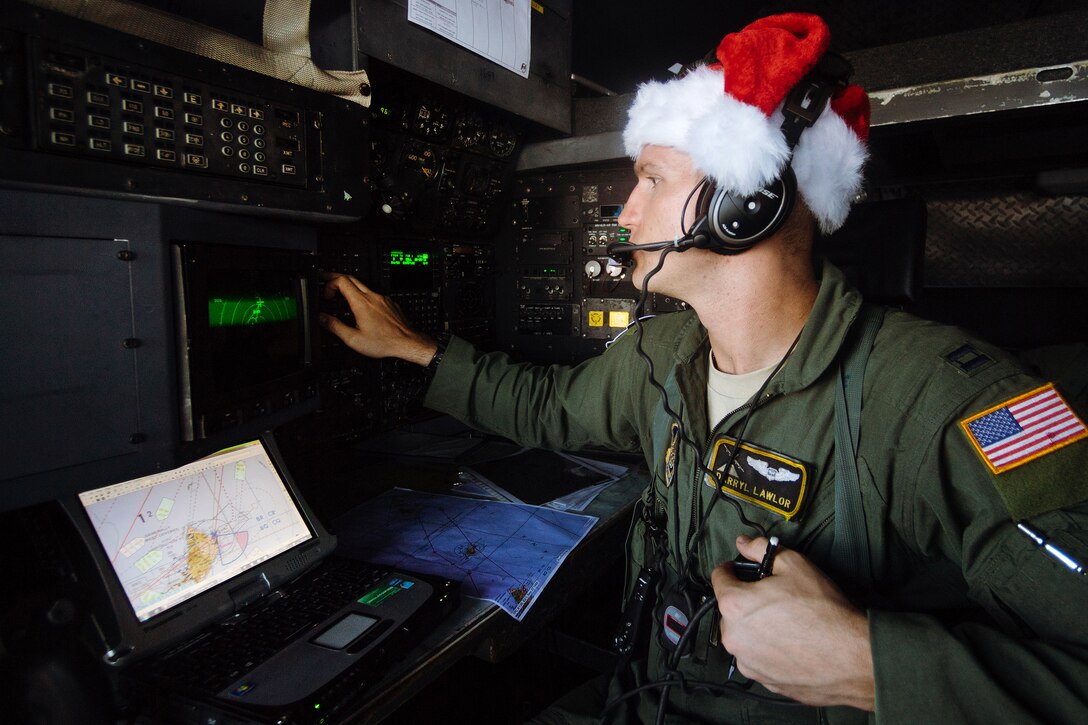 Air Force Capt. Darryl Lawlor operates navigation instruments during Operation Christmas Drop over remote Micronesian islands, Dec. 5, 2016. Lawlor is a navigator assigned to the 36th Airlift Squadron. Air Force photo by Senior Airman Delano Scott