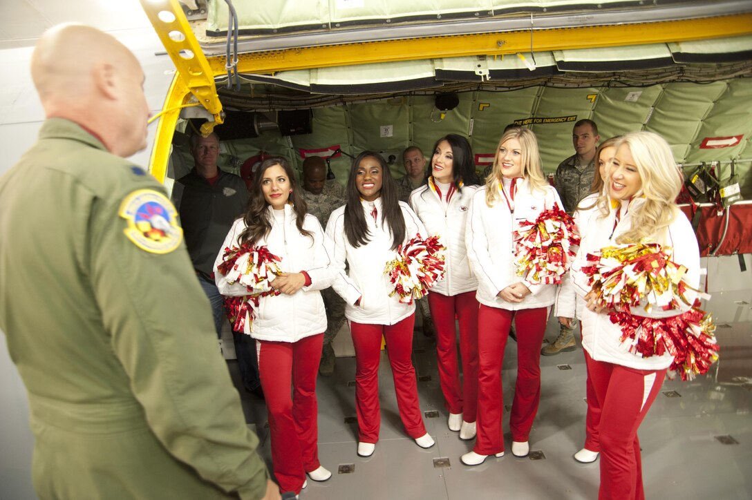 Lt. Col. Lanson Ross (left), 459th Operations Support Squadron chief of current operations, conducts a tour of a KC-135 Stratotanker for several Kansas City Chiefs cheerleaders Dec. 3, 2016 at Joint Base Andrews, Md. The NFL cheerleaders visited JBA as part of a military appreciation event where they greeted and entertained members of Team Andrews. (U.S. Air Force photo by Staff Sgt. Joe Yanik)