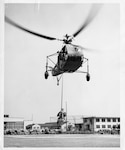 U.S. Coast Guard District 14 Hawaii Pacific BRIDGEPORT, CT, UNITED STATES - Cmdr. Frank Erickson hoists Igor Sikorsky during the development of the hoist capable helicopter in the early 1940s in Bridgeport, Conn. Erickson went on to fly many missions, save many lives, train many pilots and redefine Coast Guard aviation.