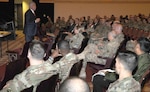 Bob Delaney, a motivational speaker on post-traumatic stress and resiliency, speaks to Soldiers and civilians assigned to Joint Base San Antonio-Fort Sam Houston at the Fort Sam Houston Theater Friday. Delaney serves as the director of officials for the National Basketball Association and was a highly decorated trooper with the New Jersey State Police.