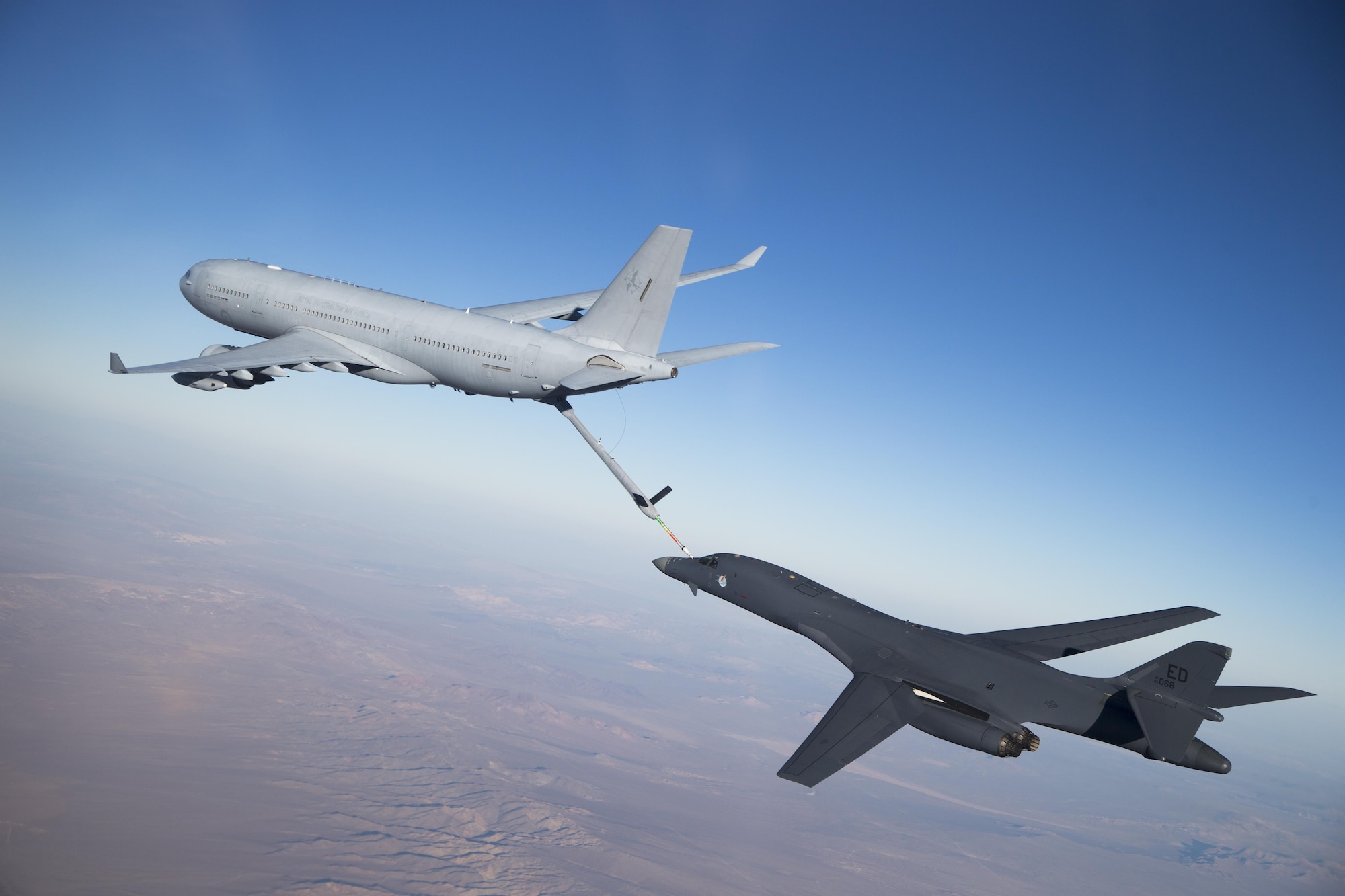 A Royal Australian Air Force K-30A refuels a U.S. Air Force B-1 Bomber as part of the Coalition Aerial Refueling Initiative.