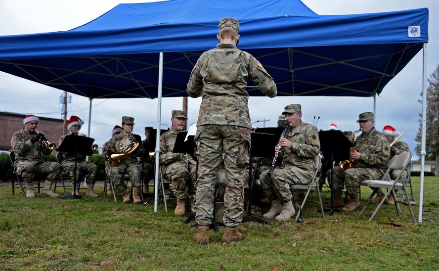 The Joint Base Lewis-McChord Army Band plays holiday music during the McChord Field Annual Tree Lighting Ceremony Dec. 5, 2016 at JBLM, Wash. The ceremony had a lighting of a Menorah and a Christmas tree as well as a visit from Santa. (U.S. Air Force photo/Senior Airman Divine Cox)