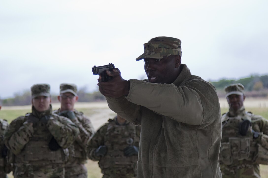 Chief Warrant Officer 3 Markell Green, an Army Reserve Soldier with the 316th Sustainment Command (Expeditionary), gives a safety class on the M9 pistol before a qualification at Fort Hood, Tx., Dec. 5, 2016. (U.S. Army photo by Staff Sgt. Dalton Smith)