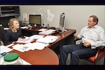 Acting DLA Energy Deputy Director Gabby Earhardt conducts a meeting with Dave Peterson, director of Direct Delivery Fuels, at the McNamara Complex, Fort Belvoir, Virginia Dec. 1. Photo by Irene Smith