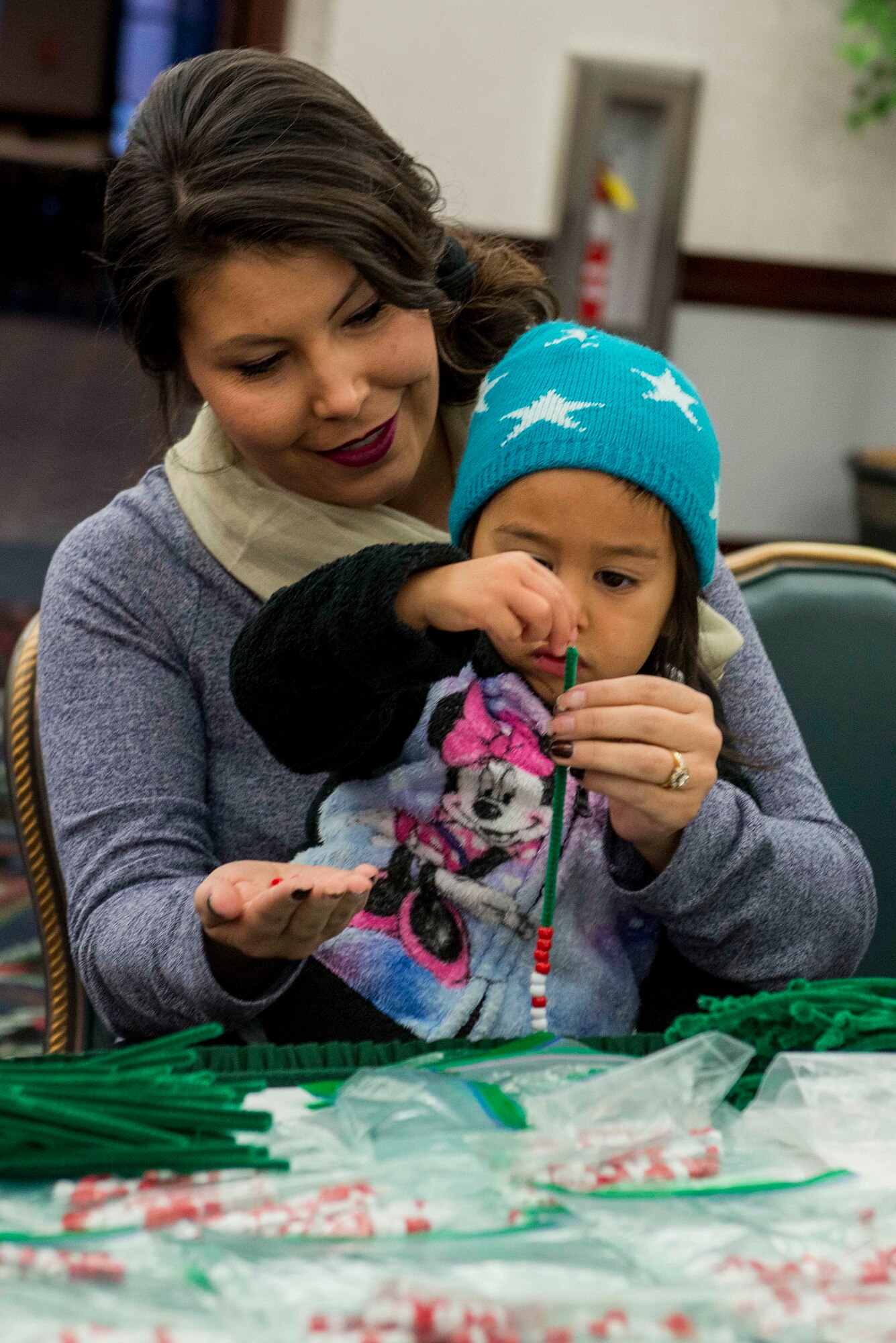 Many Scott Air Force Base service members and families attended the annual holiday party and tree lighting event Nov. 30, 2016. During the party, families were able to meet Santa and Mrs. Claus, participate in crafts, listen to the Scott AFB Youth Program's Choir sing holiday songs, and pick out a Christmas tree donated by Trees for Troops. Thank you to the coordinators and all the volunteers who made this event an enjoyable and memorable evening for so many people. (U.S. Air Force photo by Senior Airman Megan Friedl)