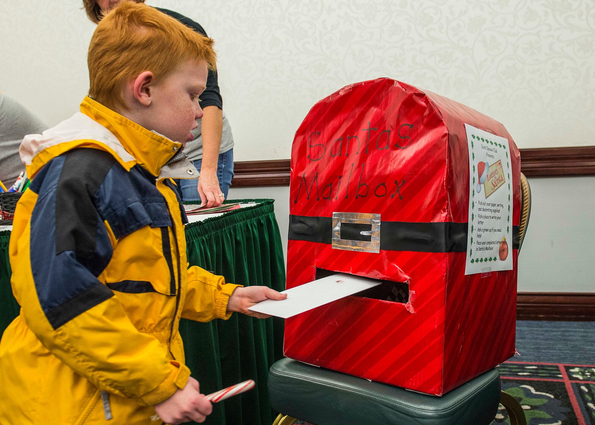 Many Scott Air Force Base service members and families attended the annual holiday party and tree lighting event Nov. 30, 2016. During the party, families were able to meet Santa and Mrs. Claus, participate in crafts, listen to the Scott AFB Youth Program's Choir sing holiday songs, and pick out a Christmas tree donated by Trees for Troops. Thank you to the coordinators and all the volunteers who made this event an enjoyable and memorable evening for so many people. (U.S. Air Force photo by Senior Airman Megan Friedl)