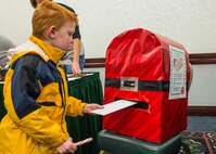 Many Scott Air Force Base service members and families attended the annual holiday party and tree lighting event Nov. 30, 2016. During the party, families were able to meet Santa and Mrs. Claus, participate in crafts, listen to the Scott AFB Youth Program's Choir sing holiday songs, and pick out a Christmas tree donated by Trees for Troops. Thank you to the coordinators and all the volunteers who made this event an enjoyable and memorable evening for so many people. (U.S. Air Force photo by Senior Airman Megan Friedl)