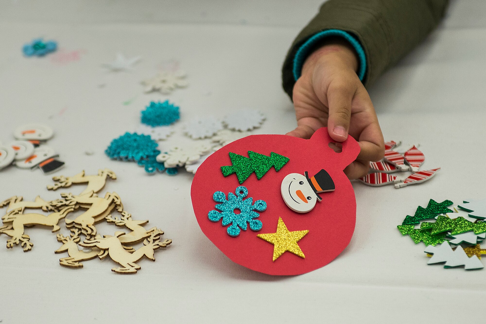 Many Scott Air Force Base service members and families attended the annual holiday party and tree lighting event Nov. 30, 2016. During the party, families were able to meet Santa and Mrs. Claus, participate in crafts, listen to the Scott AFB Youth Program's Choir sing holiday songs, and pick out a Christmas tree donated by Trees for Troops. Thank you to the coordinators and all the volunteers who made this event an enjoyable and memorable evening for so many people. (U.S. Air Force photo by Senior Airman Megan Friedl)