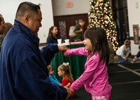 Many Scott Air Force Base service members and families attended the annual holiday party and tree lighting event Nov. 30, 2016. During the party, families were able to meet Santa and Mrs. Claus, participate in crafts, listen to the Scott AFB Youth Program's Choir sing holiday songs, and pick out a Christmas tree donated by Trees for Troops. Thank you to the coordinators and all the volunteers who made this event an enjoyable and memorable evening for so many people. (U.S. Air Force photo by Senior Airman Megan Friedl)