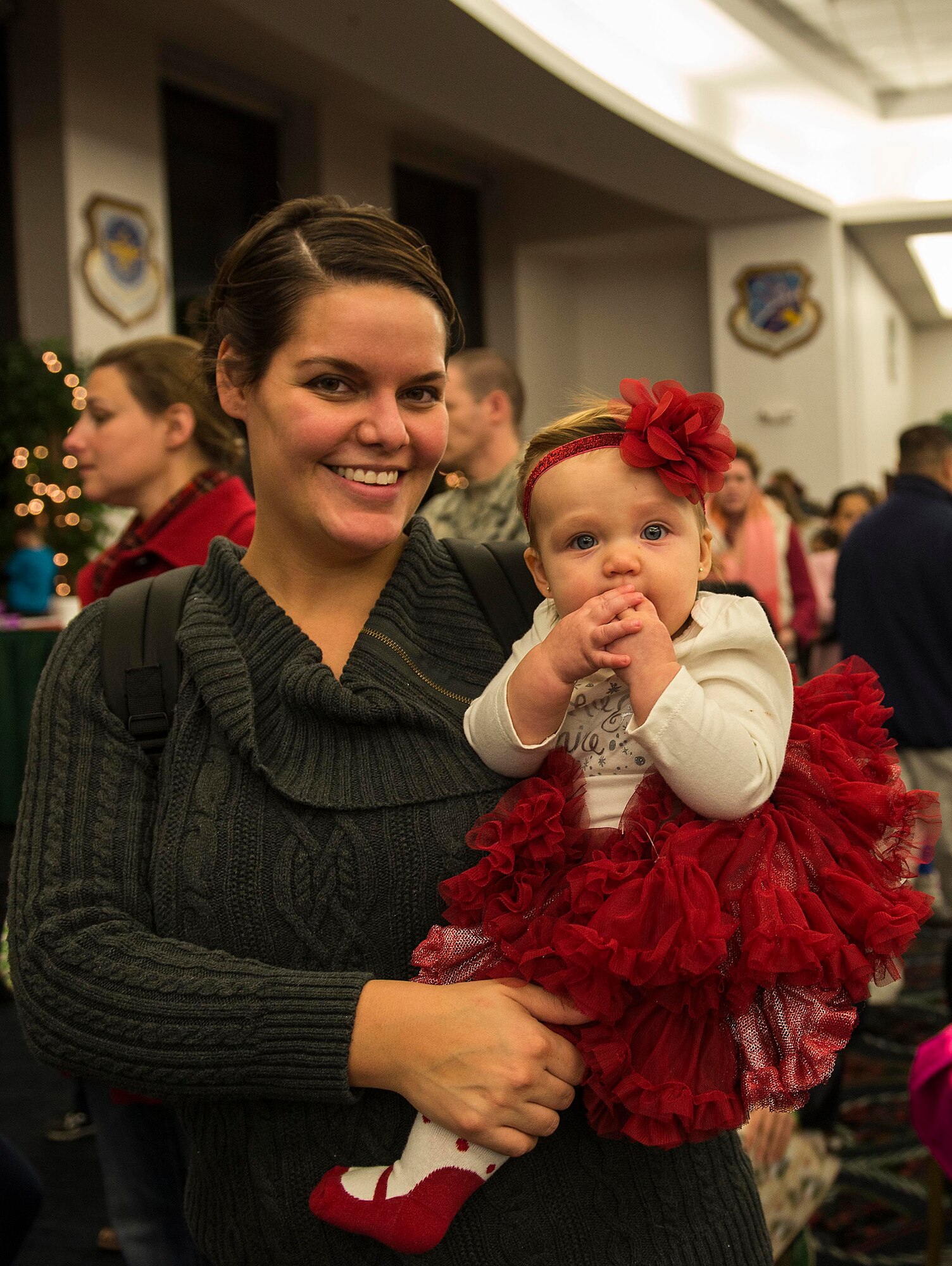 Many Scott Air Force Base service members and families attended the annual holiday party and tree lighting event Nov. 30, 2016. During the party, families were able to meet Santa and Mrs. Claus, participate in crafts, listen to the Scott AFB Youth Program's Choir sing holiday songs, and pick out a Christmas tree donated by Trees for Troops. Thank you to the coordinators and all the volunteers who made this event an enjoyable and memorable evening for so many people. (U.S. Air Force photo by Senior Airman Megan Friedl)