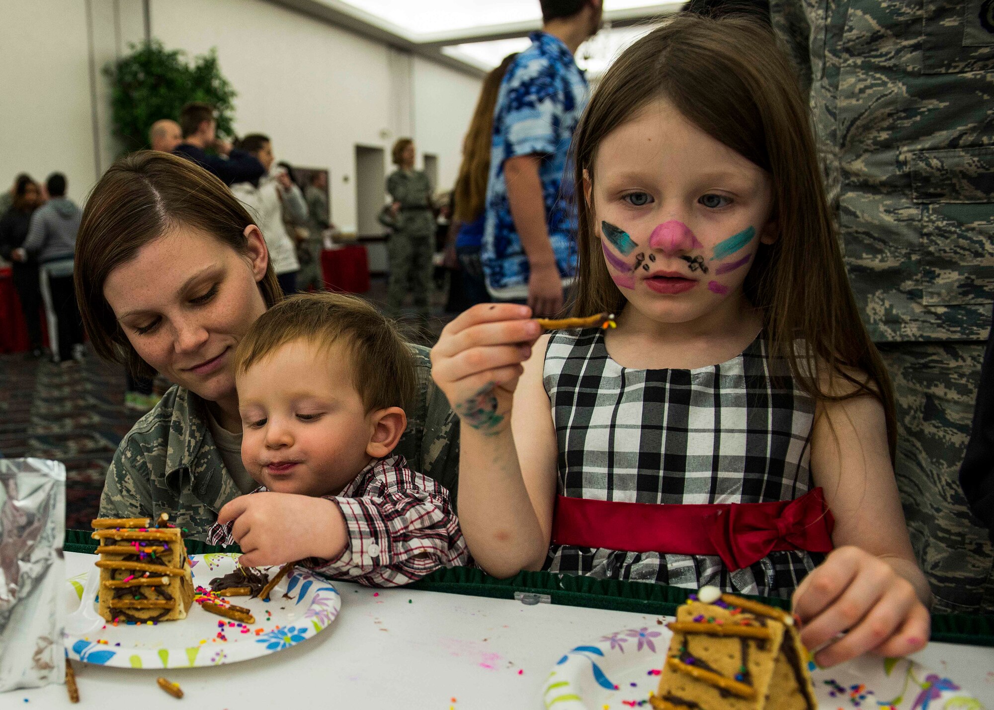 Many Scott Air Force Base service members and families attended the annual holiday party and tree lighting event Nov. 30, 2016. During the party, families were able to meet Santa and Mrs. Claus, participate in crafts, listen to the Scott AFB Youth Program's Choir sing holiday songs, and pick out a Christmas tree donated by Trees for Troops. Thank you to the coordinators and all the volunteers who made this event an enjoyable and memorable evening for so many people. (U.S. Air Force photo by Senior Airman Megan Friedl)