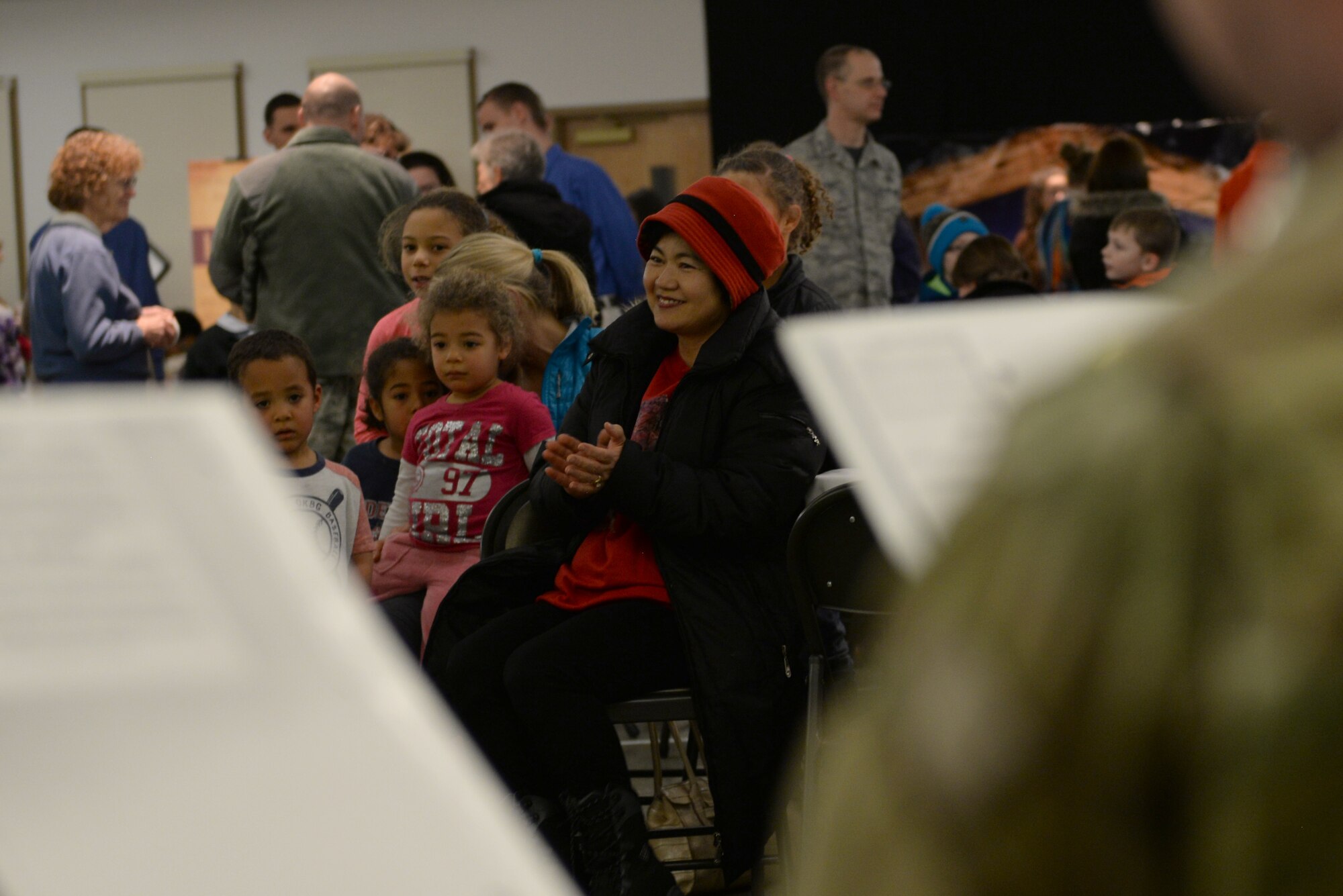 Members of the audience listen to music played during the annual 354th Fighter Wing Chapel’s Christmas Tree Lighting Dec. 2, 2016, at Eielson Air Force Base, Alaska. The music was provided by the 9th Army Band out of Fort Wainwright, Alaska. (U.S. Air Force photo by Airman Eric M. Fisher)