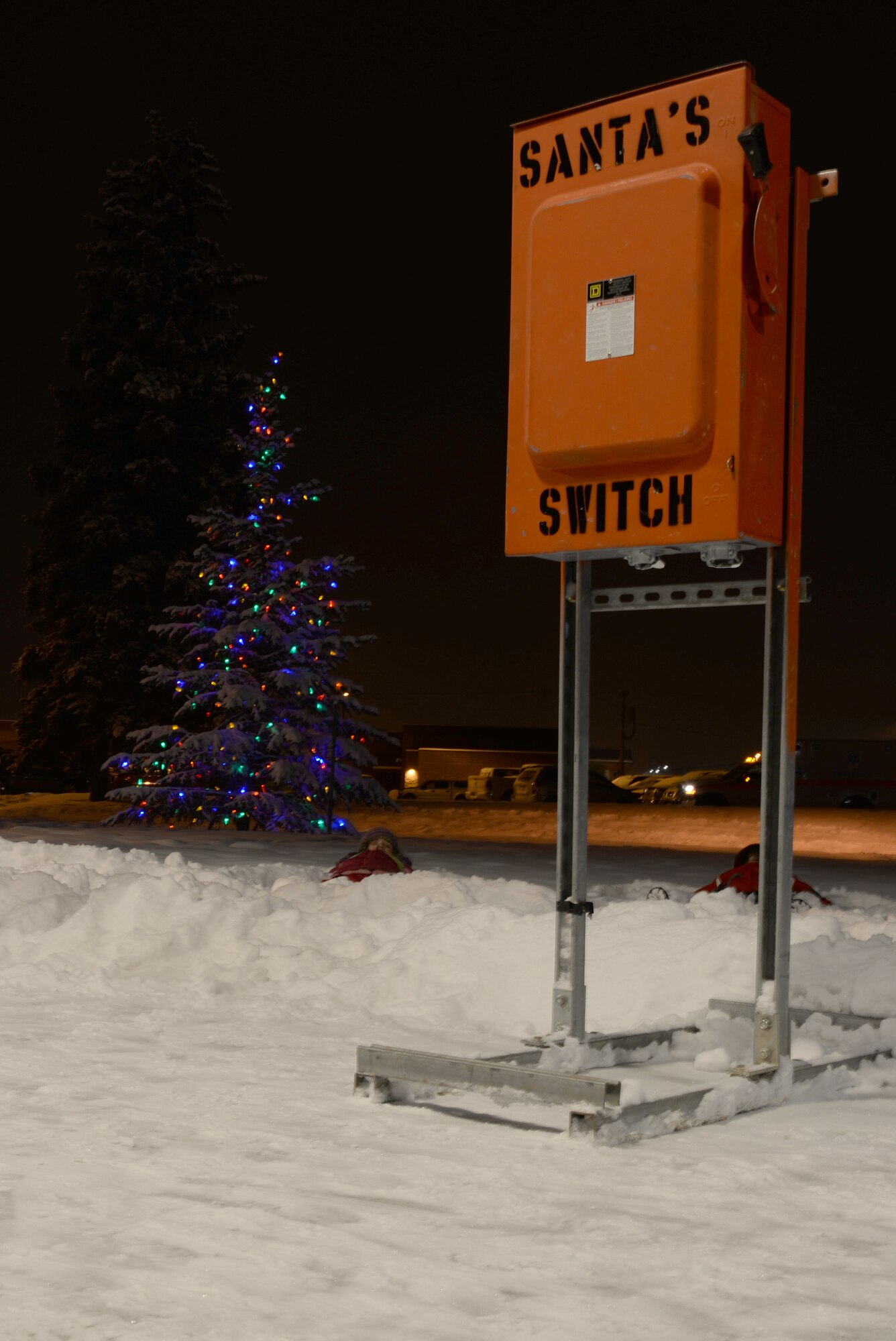 A Christmas tree stands lit outside of the Base Chapel Dec. 2, 2016, at Eielson Air Force Base, Alaska. The tree was lit during the wing-wide Winter Festival and hosted by the 354th Fighter Wing chapel staff. (U.S. Air Force photo by Airman Eric M. Fisher)