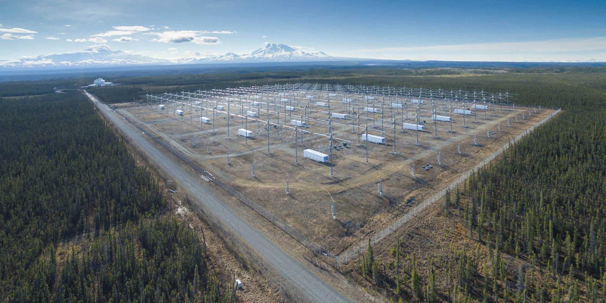 View of the High Frequency Active Auroral Research Program array with Mount Drum in the distance. Under a Cooperative Research and Development Agreement between the Air Force Research Laboratory’s Space Vehicles Directorate and the University of Alaska Fairbanks, AFRL transitioned the site to the university, ensuring that twenty-five years of atmospheric research will continue at the facility. (Courtesy photo / Jessica Matthews, University of Alaska Fairbanks)