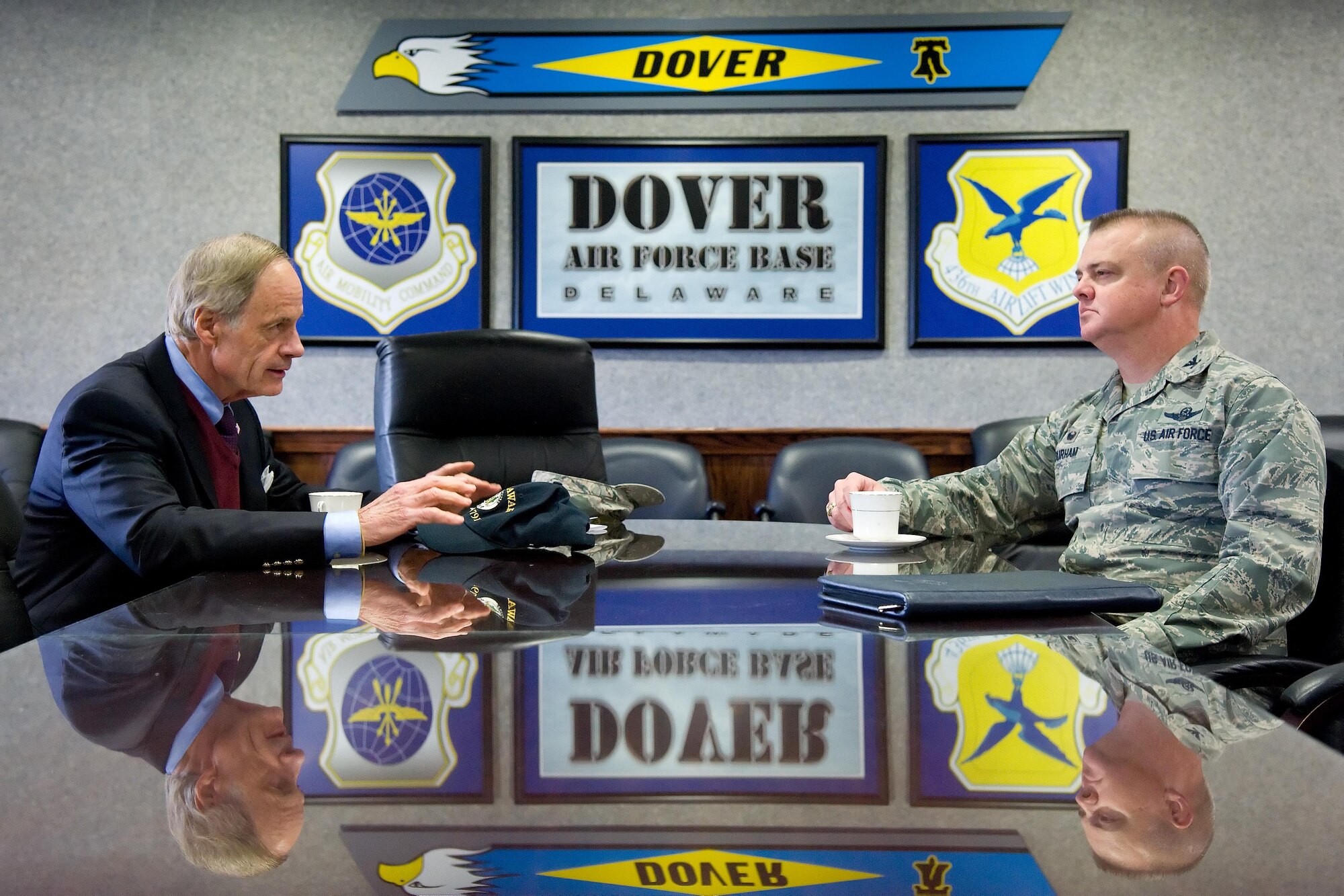 Col. D. Scott Durham, 512th Airlift Wing commander, listens to Sen. Tom Carper, D-Del., prior to the start of a meeting with Team Dover senior leadership Nov. 28, 2016, at Dover Air Force Base, Del. Carper talked with senior leaders from the 436th and 512th Airlift Wings, Air Force Mortuary Affairs Operations, Armed Forces Medical Examiner System, and the Joint Personal Effects Depot prior to the start of his tour of the base. (U.S. Air Force photo by Roland Balik)