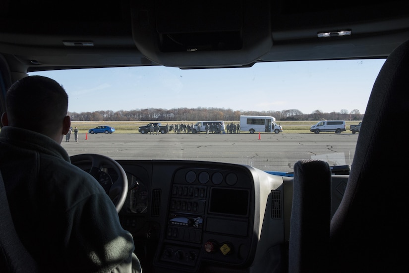 Competitors watch as Senior Airman Antonio Chaviano, 436th Logistics Readiness Squadron vehicle operations central dispatcher, backs a tractor trailer between two cones during the ground transportation rodeo Dec. 2, 2016, at Dover Air Force Base, Del. Chaviano and his partner Airman 1st Class Benjamin Mantonya, 436th LRS vehicle operator, completed the course with Team Dover’s fastest team time, nine minutes, 21 seconds. (U.S. photo by Senior Airman Aaron J. Jenne)