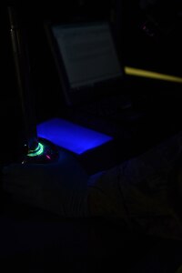 U.S. Air Force Airman 1st Class Shay Oakley, 1st Maintenance Squadron Nondestructive Inspection journeyman, inspects a piece of an aircraft at Joint Base Langley-Eustis, Va., Dec. 5, 2016. After applying a fluorescent penetrant, NDI specialists are able to identify indiscretions on an aircraft part using a black light. (U.S. Air Force photo by Senior Airman Kimberly Nagle)  