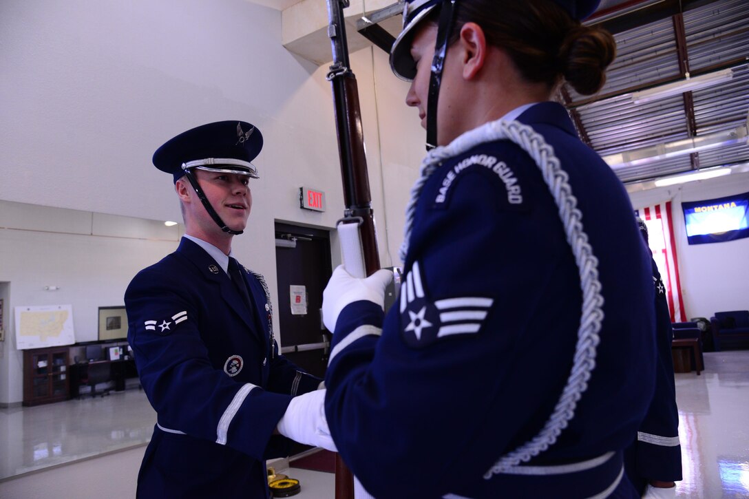 Airman 1st Class Taylor Brown, 741st Maintenance Squadron power refrigeration and electrical lab technician and prior member of the Malmstrom Honor Guard, left, and Senior Airman Cassandra Russo, 341st Comptroller Squadron finance technician, practice honor guard movements Nov. 4, 2016, at Malmstrom Air Force Base, Mont. Honor Guard members depend on each other for training and critical technique development. (U.S. Air Force photo/Airman 1st Class Magen M. Reeves)