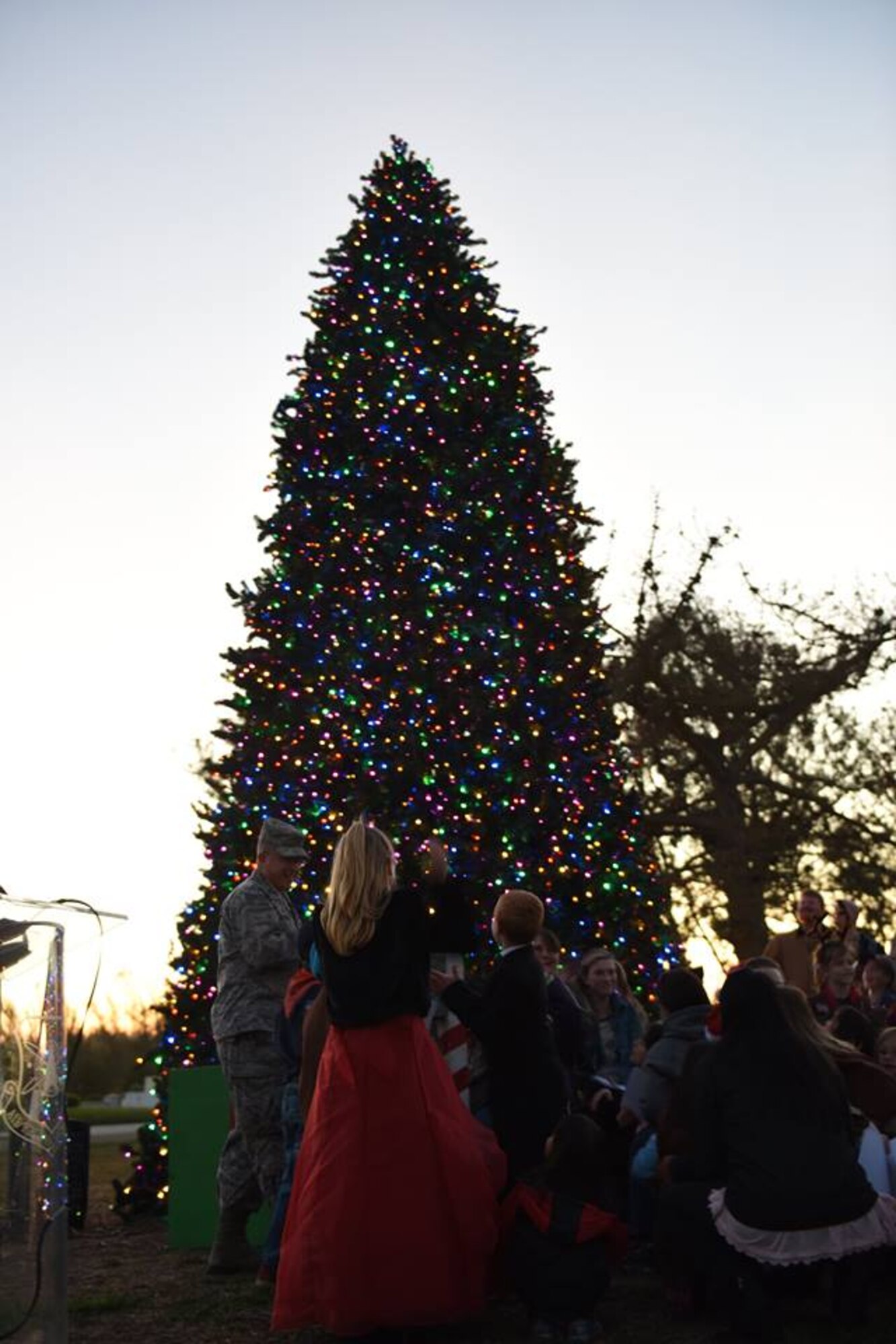 Col. J. Christopher Moss, 30th Space Wing commander, conducts the Holiday Tree lighting ceremony on base in front of the Pacific Coast Club, Dec. 1, 2016, Vandenberg Air Force Base, Calif. The tree lighting was organized by the VAFB Company Grade Officers Council and featured troops of girl and cub scouts who sang carols during the event. (U.S. Air Force photo by Senior Airman Ian Dudley/ Released)