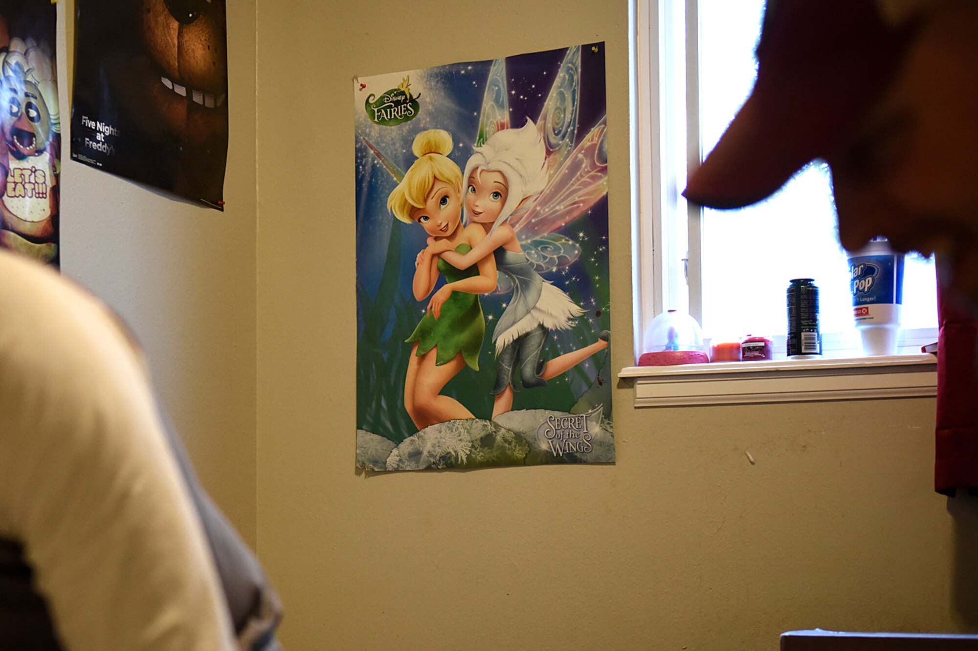 COLORADO SPRINGS, Colo. – A child’s poster hangs on the wall of a Peterson Airman’s house in Colorado Springs, Colo., while volunteers work to install new flooring Nov. 5, 2016. Sixteen volunteers from units around base came together to ensure the Airman could focus on helping his family and not the logistics of repairing the flooring. (U.S. Air Force photo by Senior Airman Rose Gudex)