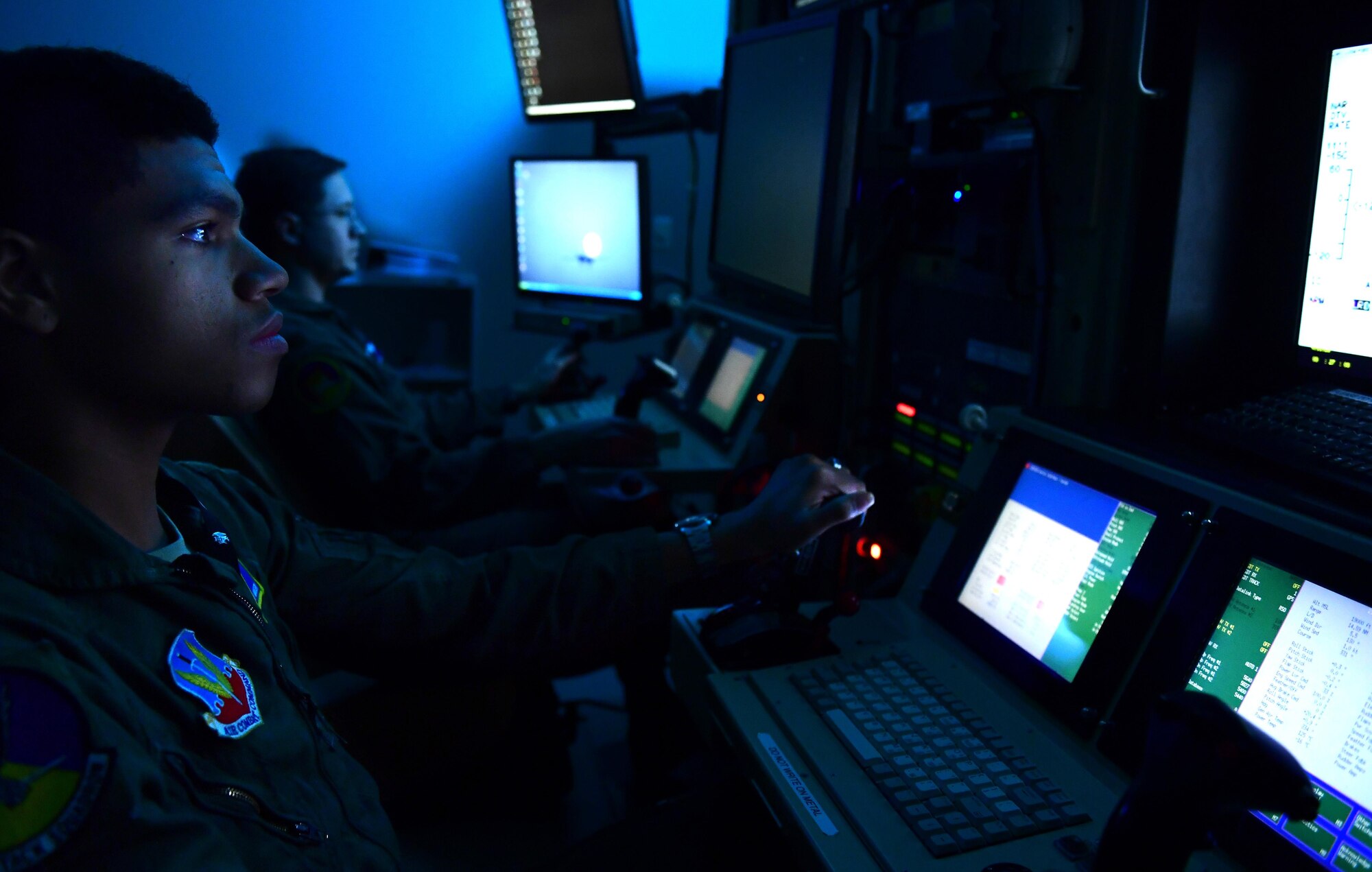 Airman 1st Class Matthew, 15th Attack Squadron MQ-1 Predator sensor operator follows a moving target alongside an MQ-1 pilot during a training mission Dec. 5, 2016, at Creech Air Force Base, Nev. Despite the remotely piloted aircraft stigma that operators don’t feel anything when conducting weapons strikes, Matthew explained he felt nervous, cold, and his heart raced during his first weapons strike in support of ground forces. (U.S. Air Force photo by Senior Airman Christian Clausen)