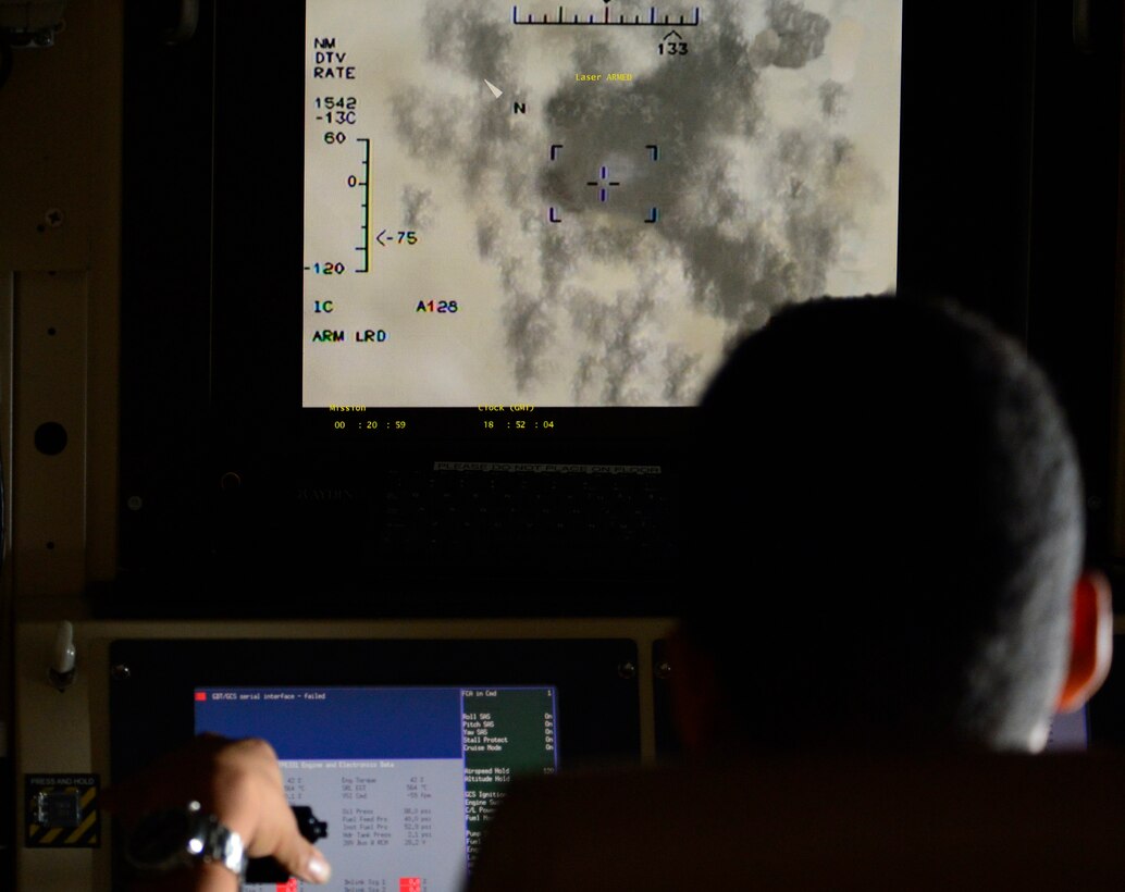 Airman 1st Class Matthew, 15th Attack Squadron MQ-1 Predator sensor operator, destroys a simulated target during a training mission Dec. 5, 2016, at Creech Air Force Base, Nev. Shortly after completing his extensive sensor operator training at age 20, Matthew successfully completed his first weapons strike. (U.S. Air Force photo by Senior Airman Christian Clausen)