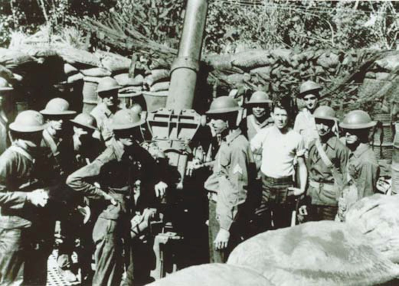 Gun crew from 200th Coast Artillery Regiment, New Mexico National Guard, with 3-inch M2 anti-aircraft gun in the Philippine Islands, in late 1941 or early 1942.
