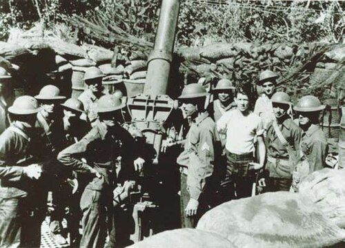 Gun crew from 200th Coast Artillery Regiment, New Mexico National Guard, with 3-inch M2 anti-aircraft gun in the Philippine Islands, in late 1941 or early 1942.

