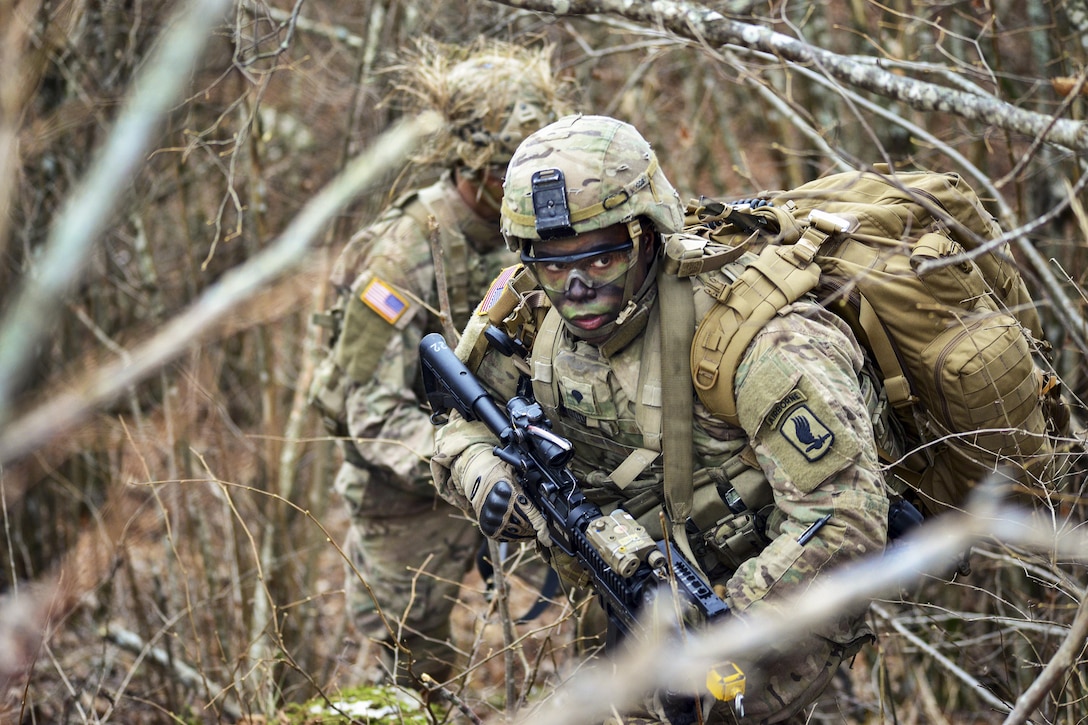 Soldiers move through the woods during a live-fire exercise as part of Exercise Mountain Shock in Pocek Range in Slovenia, Dec. 5, 2016. U.S. and Slovenian forces participated in the emergency response deployment exercise, which focuses on rapid deployment and team cohesion with weapon systems tactics and procedures. The U.S. soldiers are paratroopers assigned to 1st Squadron, 91st Cavalry Regiment, 173rd Airborne Brigade. Army photo by Davide Dalla Massara
