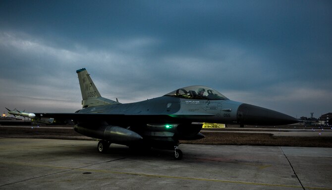U.S. Air Force Capt. Erik Kitaif, 35th Fighter Squadron pilot, parks an F-16 Fighting Falcon outside of its hangar bay at Kunsan Air Base, Republic of Korea (ROK), Dec. 4, 2016. U.S. and ROK airmen train together regularly to increase interoperability and ultimately enhances U.S. and ROK commitments to maintain peace in the region. (U.S. Air Force photo by Senior Airman Colville McFee/Released)