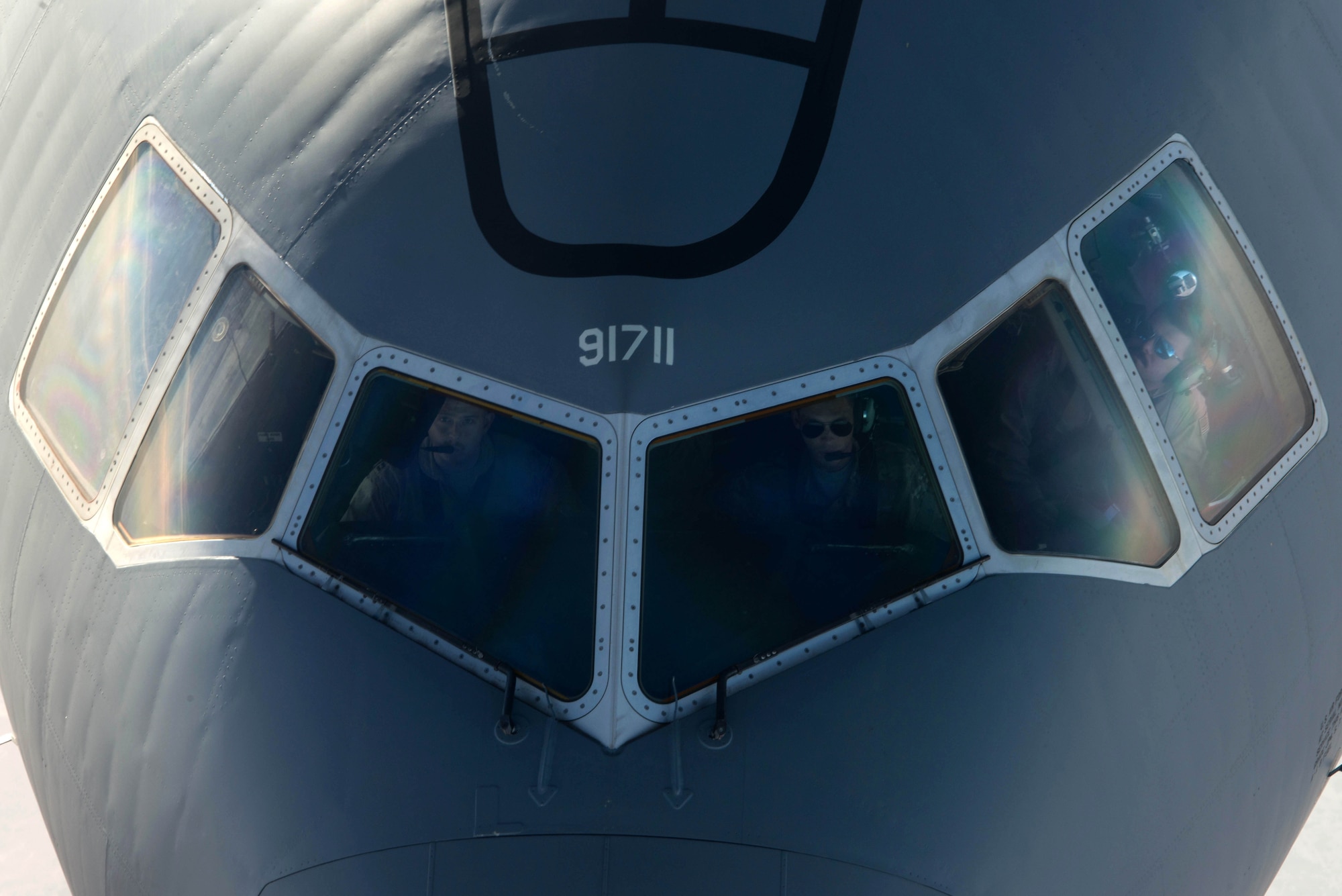 A U.S. Air Force KC-10 Extender air crew waits to finish refueling while flying near Mosul, Iraq, Nov. 20, 2016. The KC-10 Extender is an Air Mobility Command advanced tanker and cargo aircraft designed to provide increased global mobility for U.S. and Coalition armed forces. (U.S. Air Force photo by Staff Sgt. R. Alex Durbin)