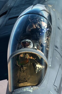 Two U.S. Air Force F-15E Strike Eagle pilots refuel while flying near Mosul, Iraq, Nov. 20, 2016. The F-15E Strike Eagle is a dual-role fighter designed to perform air-to-air and air-to-ground missions. An array of avionics and electronics systems gives the F-15E the capability to fight at low altitude, day or night, and in all weather. (U.S. Air Force photo by Staff Sgt. R. Alex Durbin)