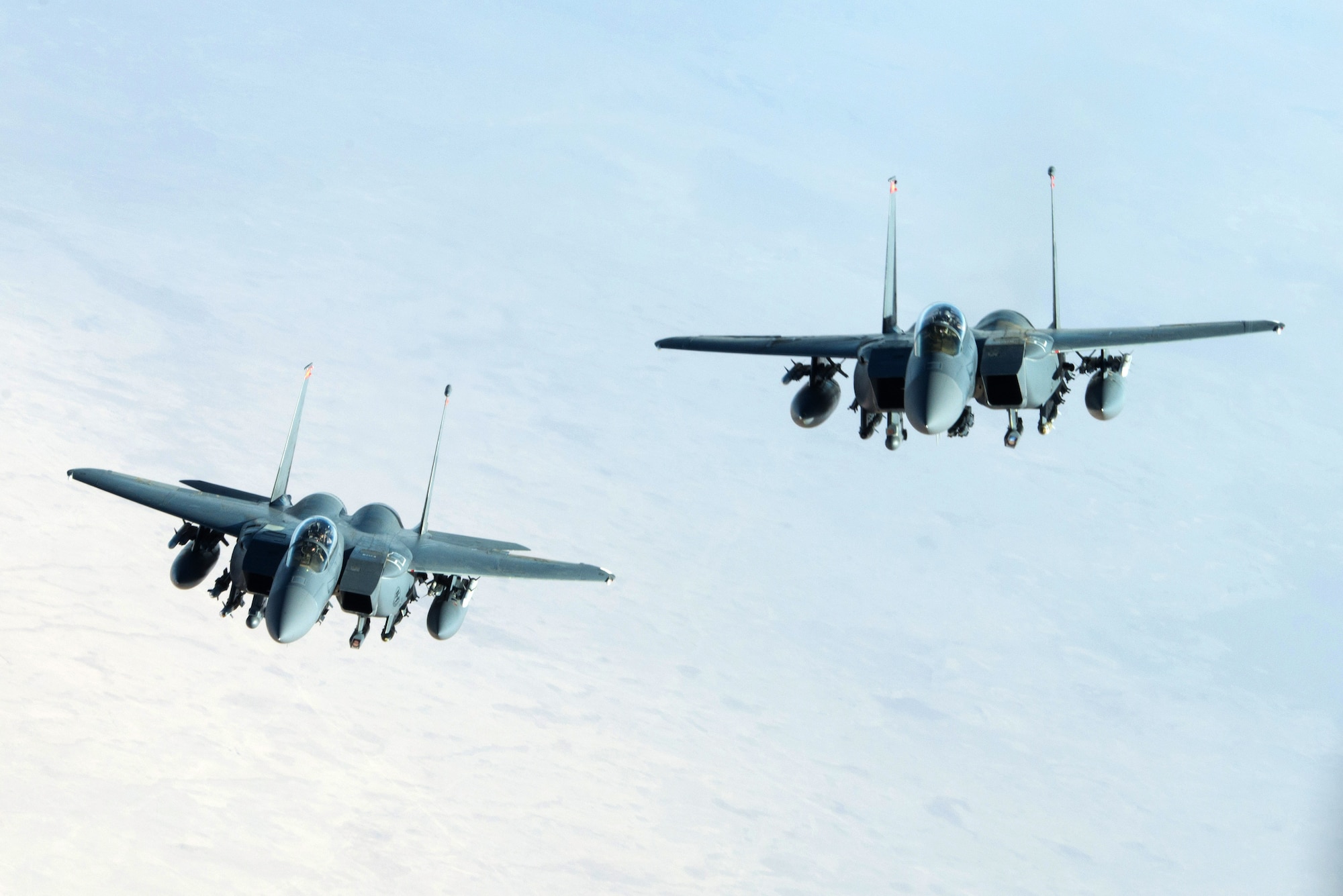Two U.S. Air Force F-15E Strike Eagles fly in formation near Mosul, Iraq, Nov. 20, 2016. To date, Coalition forces have flown thousands of combat sorties using a wide range of strike aircraft to dismantle, disrupt and ultimately destroy Da'esh by striking infrastructure, roadways and other high-value targets. (U.S. Air Force photo by Staff Sgt. R. Alex Durbin)