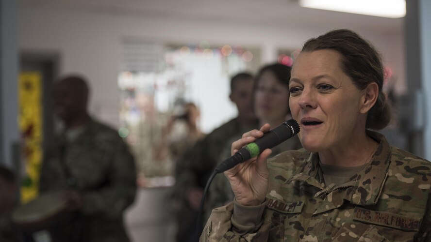 Master Sgt. Julie Bradley, U.S. Air Forces Central Command Band member, sings to service members Dec. 5, 2016 at the Craig Joint Theater Hospital, Bagram Airfield, Afghanistan. The AFCENT band is made up of professional Airmen musicians who use music to raise service member morale and bridge language and cultural differences in the Central Command area of responsibility. (U.S. Air Force photo by Staff Sgt. Katherine Spessa)