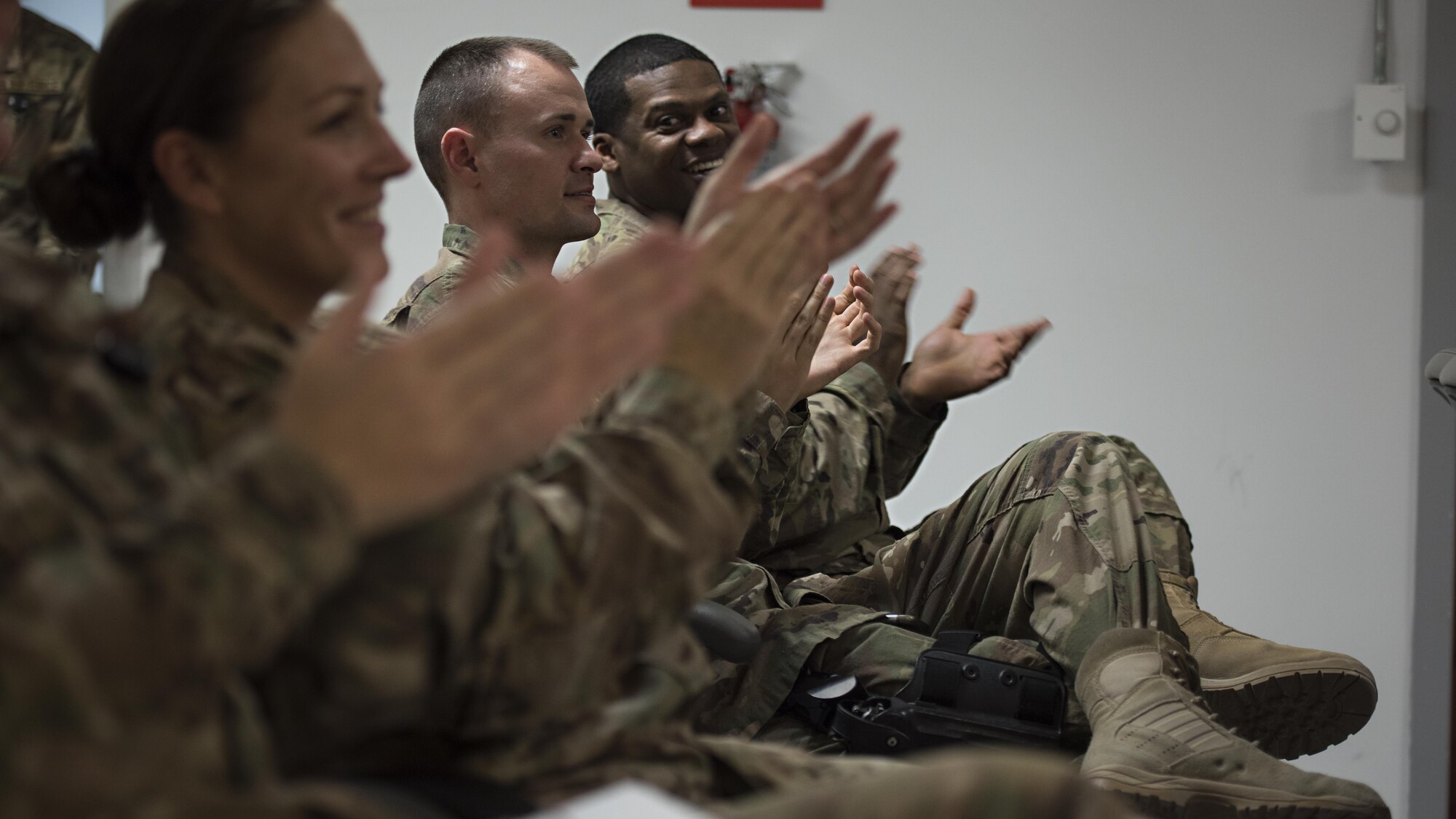 Service members applaud during a performance by the U.S. Air Forces Central Command Band Dec. 5, 2016 at the Craig Joint Theater Hospital, Bagram Airfield, Afghanistan. AFCENT Band’s Hyper Sonic ensemble performed at several locations around Bagram to raise service member morale. (U.S. Air Force photo by Staff Sgt. Katherine Spessa)