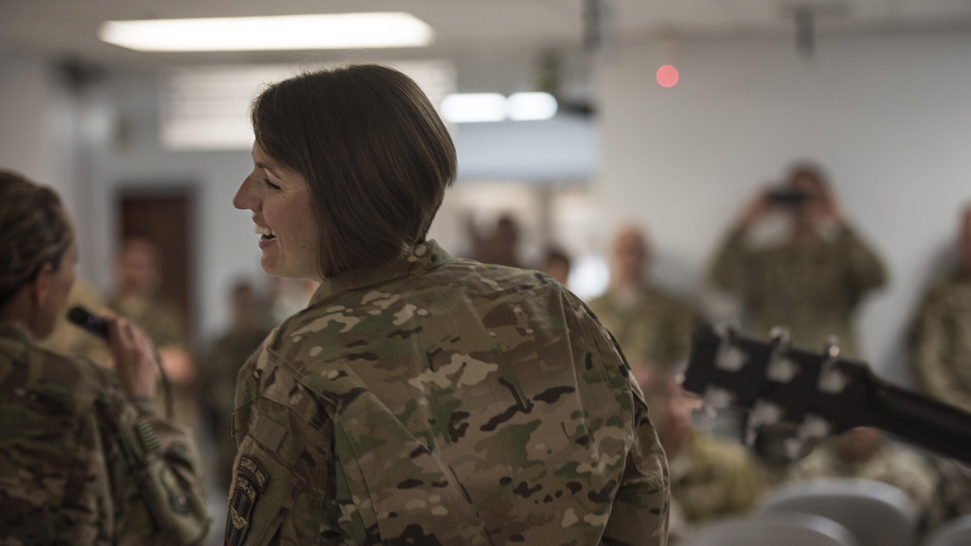 Staff Sgt. Joanne Griffin, U.S. Air Forces Central Command Band member, sings to service members Dec. 5, 2016 at the Craig Joint Theater Hospital, Bagram Airfield, Afghanistan. Griffin is part of AFCENT’s Hyper Sonic ensemble deployed to Al Udeid Air Base, Qatar, from Yokota Air Base, Japan. (U.S. Air Force photo by Staff Sgt. Katherine Spessa)