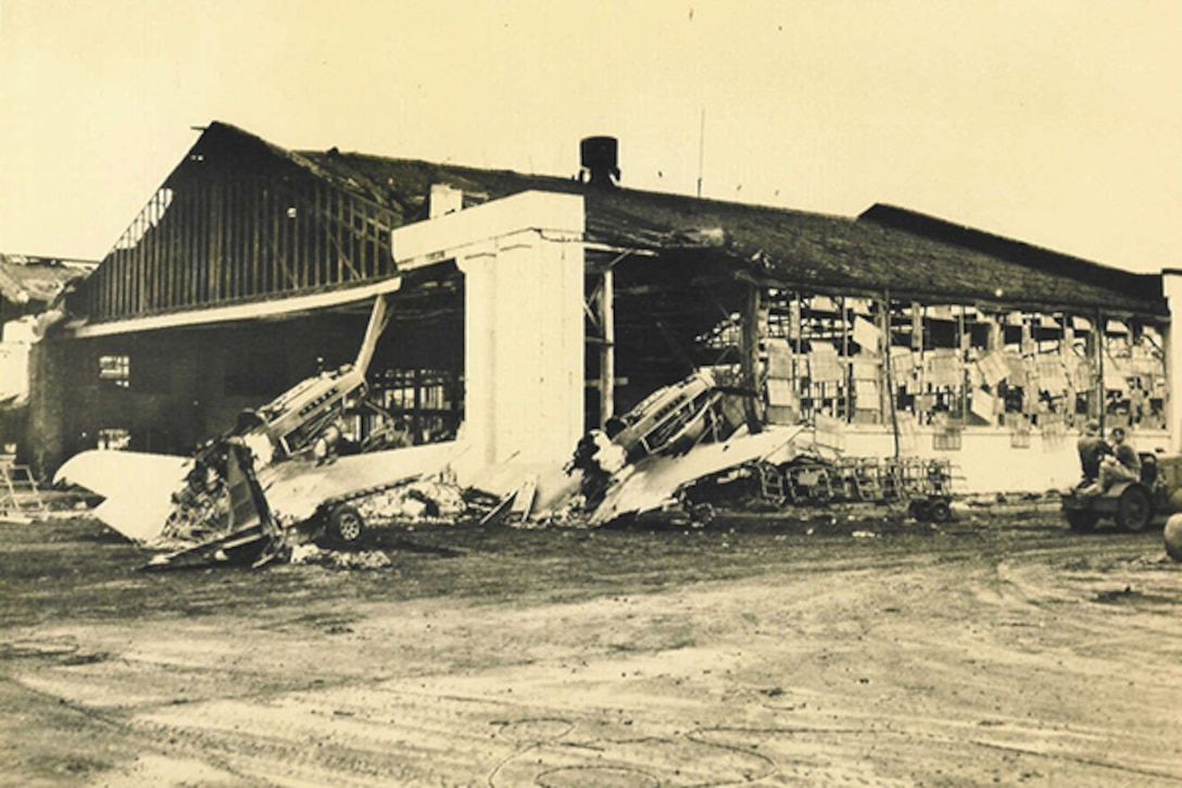 Hangar 3 and various aircraft are damaged on Wheeler Field after the Pearl Harbor attacks. Photo courtesy of Tropic Lightning Museum