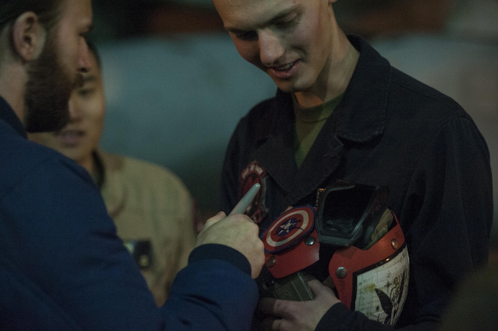 Actor Chris Evans signs a service member’s protective gear Dec. 5, 2016, at Incirlik Air Base, Turkey. Evans was one of many USO entertainers to visit Incirlik as a part of the 2016 USO Holiday Visit. The visit also included actress Scarlet Johansson, 4-time Olympic medalist Maya DiRado, entertainer Jim Karol, country music star Craig Campbell and NBA legend Ray Allen. (U.S. Air Force photo by Tech. Sgt. Joshua T. Jasper)