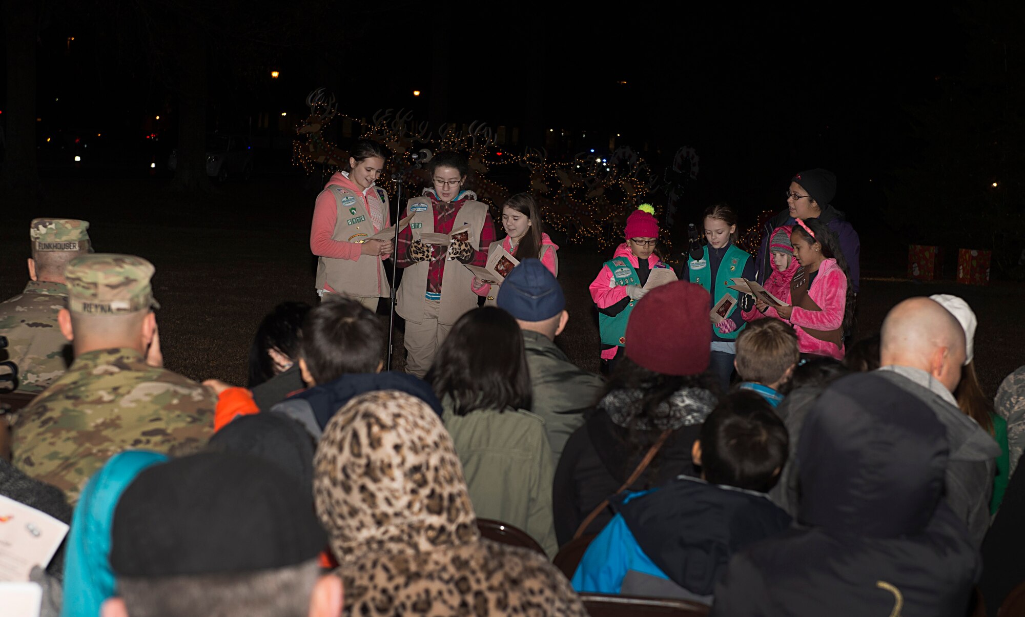 Girl Scouts of the Colonial Coast sing carols during the 61st annual Holiday Tree Lighting celebration at Joint Base Langley-Eustis, Va., Dec. 2, 2016. The celebration included a visit from Santa and Mrs. Claus, crafts and caroling music by Woodside High School choral students and the U.S. Army Training and Doctrine Command Band. (U.S. Air Force photo by Airman 1st Class Derek Seifert)