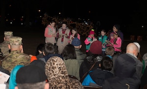 Girl Scouts of the Colonial Coast sing carols during the 61st annual Holiday Tree Lighting celebration at Joint Base Langley-Eustis, Va., Dec. 2, 2016. The celebration included a visit from Santa and Mrs. Claus, crafts and caroling music by Woodside High School choral students and the U.S. Army Training and Doctrine Command Band. (U.S. Air Force photo by Airman 1st Class Derek Seifert)