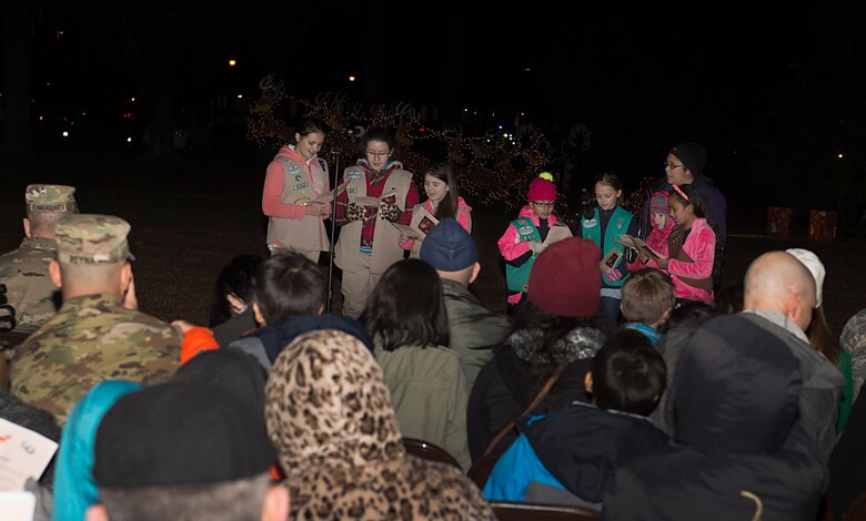 Girl Scouts of the Colonial Coast sing carols during the 61st annual Holiday Tree Lighting celebration at Joint Base Langley-Eustis, Va., Dec. 2, 2016. The celebration included a visit from Santa and Mrs. Claus, crafts and caroling music by Woodside High School choral students and the U.S. Army Training and Doctrine Command Band. (U.S. Air Force photo by Airman 1st Class Derek Seifert)
