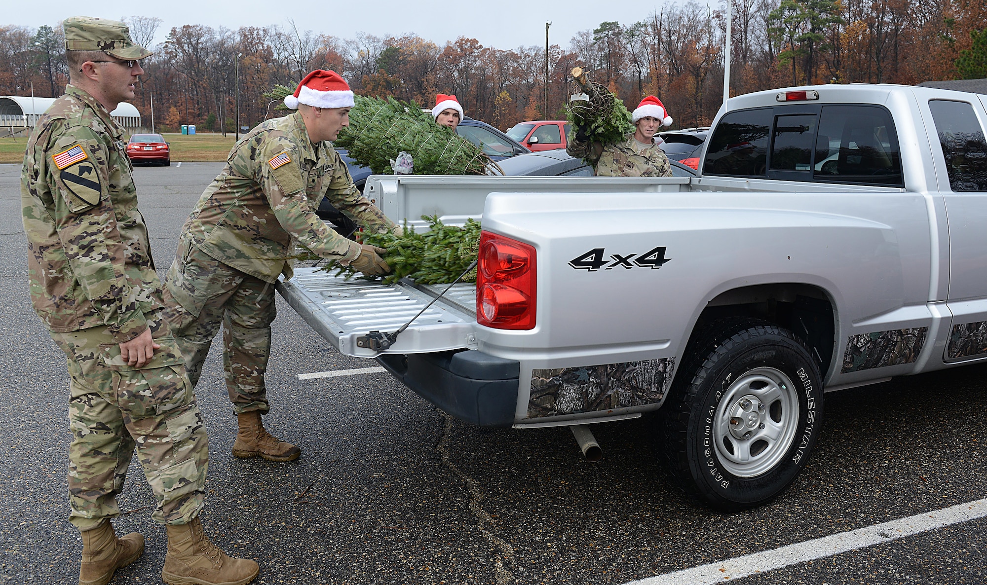 U.S. Army Soldiers from the 11th Transportation Battalion, 7th Transportation Brigade (Expeditionary), load trees from the Christmas SPIRIT Foundation’s Trees for Troops program at Joint Base Langley-Eustis, Va., Dec. 5, 2016. This year, JBLE received 550 trees from the Trees for Troops program. (U.S. Air Force photo by Staff Sgt. Teresa J. Cleveland)